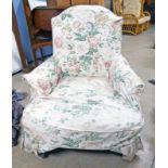19TH CENTURY OVERSTUFFED ARMCHAIR ON TURNED SUPPORTS Condition Report: The fabric is