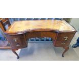 MAHOGANY LEATHER TOPPED SHAPED DESK WITH CENTRALLY SET DRAWER FLANKED BY 2 DRAWERS TO EITHER SIDE,