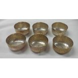 SET OF 6 WHITE METAL EASTERN BOWLS EMBOSSED WITH FOLIATE DECORATION - 12.