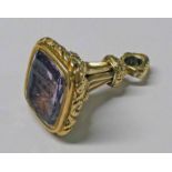 YELLOW METAL SEAL FOB SET WITH ENGRAVED INTAGLIO AMETHYST Condition Report: Weight: