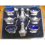 SILVER 8-PIECE CRUET SET WITH BLUE GLASS LINERS & SPOONS,