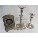 TWO SILVER CANDLESTICKS, SHEFFIELD 1931 AND BIRMINGHAM 1924 TOGETHER WITH SILVER PICTURE FRAME,