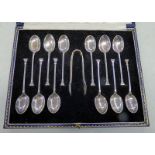 CASED SET OF 12 SILVER TEASPOONS AND TONGS.