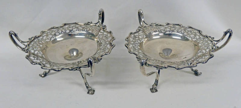 PAIR OF EDWARDIAN SILVER 3-HANDLED DISHES WITH PIERCED BORDER ON 3 SCROLL SUPPORTS,