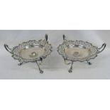 PAIR OF EDWARDIAN SILVER 3-HANDLED DISHES WITH PIERCED BORDER ON 3 SCROLL SUPPORTS,