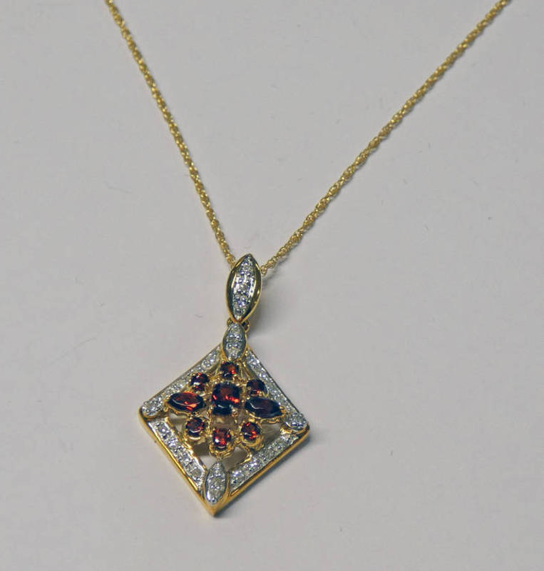 9CT GOLD DIAMOND & MOZAMBIQUE GARNET PENDANT ON 9CT GOLD CHAIN Condition Report: