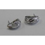 PAIR DIAMOND SET EAR CLIPS SET IN WHITE GOLD MARKED 750 Condition Report: Weight: 7.