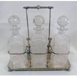 EARLY 20TH SILVER PLATED TANTALUS WITH 3 ETCHED GLASS DECANTERS Condition Report: