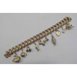 YELLOW GOLD FANCY LINK BRACELET WITH 9CT GOLD CHARMS, THE BRACELET MARKED 750 - 19 CM LONG & 92.