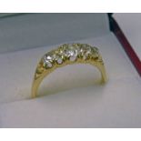 5 STONE DIAMOND SET RING, THE CUSHION SHAPED DIAMONDS IN A YELLOW METAL MOUNT APPROX 1.