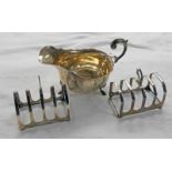 TWO SILVER TOAST RACKS, SHEFFIELD 1932 TOGETHER WITH A SILVER SAUCE BOAT,