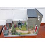 DOLLS HOUSE WITH GARDEN AREA AND ACCESSORIES.