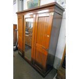 ARTS AND CRAFTS OAK WARDROBE WITH MIRROR DOOR FLANKED BY 2 PANEL DOORS WITH BRASS FITTINGS,