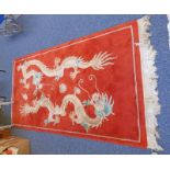 RED GROUND CHINESE CARPET DECORATED WITH DRAGONS 123 X 220 CM