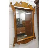 LATE 19TH CENTURY WALNUT FRAMED MIRROR WITH CARVED DECORATION,