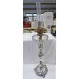 19TH CENTURY SILVER PLATE PARAFFIN LAMP WITH FOLIATE DECORATED COLUMN AND CUT GLASS RESERVOIR,