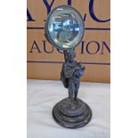 ANEROID BAROMETER WITH MAGNIFYING FRONT IN METAL FIGURE STAND,