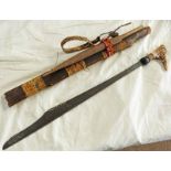 HEAD HUNTERS SWORD WITH CARVED BONE HILT ON 53CM BLADE INLAID WITH BRASS AND PIERCED DECORATION IN