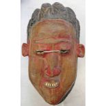 WEST AFRICAN MASK WITH CARVED HAIR AND TRACES OF RED PAINT TO FACE, 23.