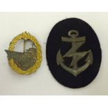 THIRD REICH KRIEGSMARINE DESTROYER BADGE AND A SLEEVE BADGE FROM A RADIO OPERATOR WARRANT OFFICER