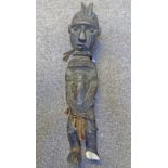 A LATE 19TH EARLY 20TH CENTURY AFRICAN WOODEN FIGURE,