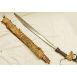 DAYAK HEAD HUNTERS SWORD WITH 49 CM LONG BLADE CARVED BONE HILT WITH CORD AND HAIR TASSELS IN A