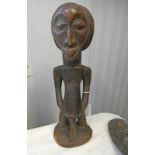 HEMBA MALE FIGURE WITH STYLIZED PLAIT COIFFURE AND CARVED DECORATION,