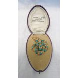 19TH CENTURY TURQUOISE SET SCROLL WORK BROOCH IN FITTED CASE Condition Report: Some