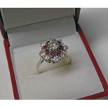 RUBY & DIAMOND CLUSTER RING, THE CENTRAL DIAMOND OF APPROX 0.