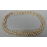LONG STRAND OF FRESH WATER PEARL BEADS,