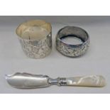 2 SILVER NAPKIN RINGS AND SILVER & MOTHER OF PEARL BUTTERKNIFE