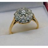 DIAMOND SET CLUSTER RING MARKED 18CT TOTAL DIAMOND WEIGHT OF APPROX 1.