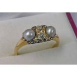 LATE 19TH CENTURY PEARL & DIAMOND SET RING MARKED 18 CT WITH 2 OLD BRILLIANT CUT DIAMONDS & ROSE