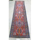 RED AND BLUE GROUND PERSIAN RUNNER WITH MEDALLION DESIGN 350 X 100CM Condition Report: