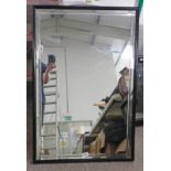 RECTANGULAR MIRROR WITH DECORATED BORDER IN BLACK METAL FRAME,