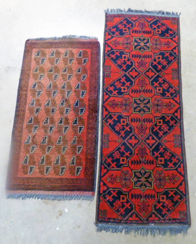 TWO RED AND BLUE EASTERN RUGS - 143 X 55 CMS & 100 X 52 CMS