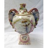 FRENCH FAIENCE PORCELAIN VASE WITH PAINTED PARCELS & TWIN BACCHUS MASK HANDLES ON SQUARE BASE WITH