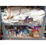 SELECTION OF LINEN & PORCELAIN OVER TWO SHELVES