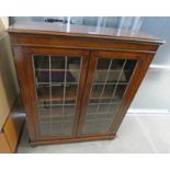 OAK BOOKCASE WITH 2 LEADED GLASS DOORS 111CM TALL X 92CM WIDE