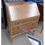 WALNUT BUREAU WITH FALL FRONT OPENING TO FILLED INTERIOR OVER 3 LONG DRAWERS ON SHAPED CABRIOLE