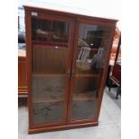 TEAK 2 DOOR CABINET WITH SHELVED INTERIOR ON PLINTH BASE