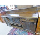 LATE 19TH CENTURY OAK SIDEBOARD WITH 4 CARVED PANEL DOORS & 2 DRAWERS ON BUN FEET 214CM LONG