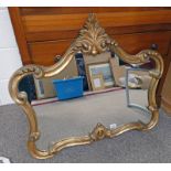 GILT MIRROR WITH SHAPED DECORATION MAX HEIGHT 67 CMS