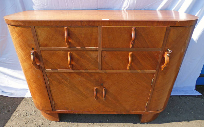 ART DECO WALNUT SIDEBOARD WITH 4 SHORT DRAWERS OVER 2 PANEL DOORS FLANKED BY CARVED DOORS WITH