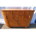 ART DECO WALNUT SIDEBOARD WITH 4 SHORT DRAWERS OVER 2 PANEL DOORS FLANKED BY CARVED DOORS WITH
