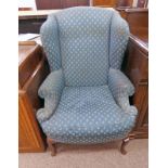 WING ARMCHAIR WITH BLUE COVERING & SHAPED SUPPORTS