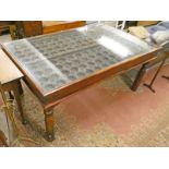 INTERESTING EASTERN DOOR TABLE WITH METAL DECORATION ON TURNED SUPPORTS.