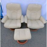 PAIR EKORNES CREAM LEATHER ARMCHAIRS & STOOL Condition Report: Both have sign of