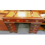 EARLY 20TH CENTURY MAHOGANY 9 DRAWER DESK WITH LEATHER INSERT TOP - 122CM WIDE