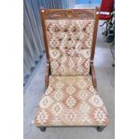 LATE 19TH/EARLY 20TH CENTURY LOW OAK FRAMED UPHOLSTERED NURSING CHAIR ON TURNED SUPPORTS